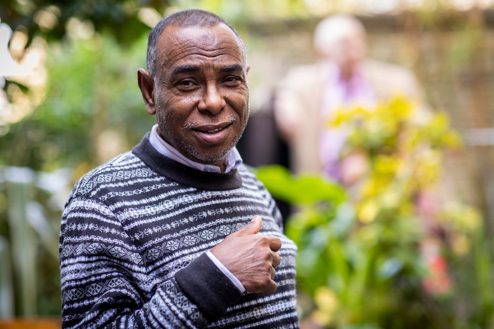 Portrait of older Black male in sweater