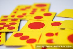 Close up of red and yellow domino playing cards with selective focus 5aXoeK