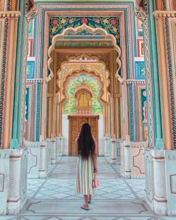 Woman in colorful dress standing in the hallway of Jawahar Circle Garden in Jagatpura, Rajasthan, India 