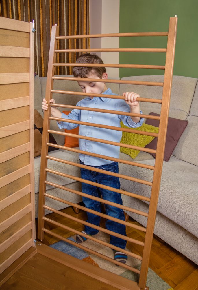 Kid assembling cot for a newborn at home