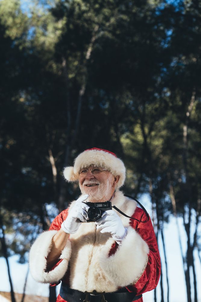 Happy Santa Claus with camera