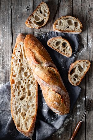 Fresh baguettes on checkered towel