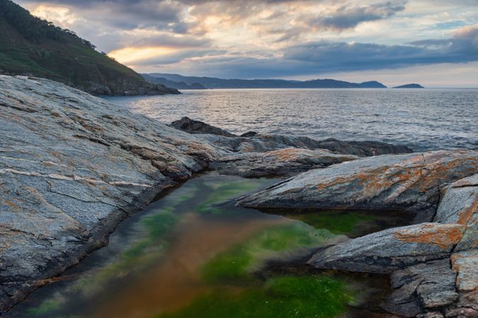 Idyllic landscape of rocked seaside and mountains