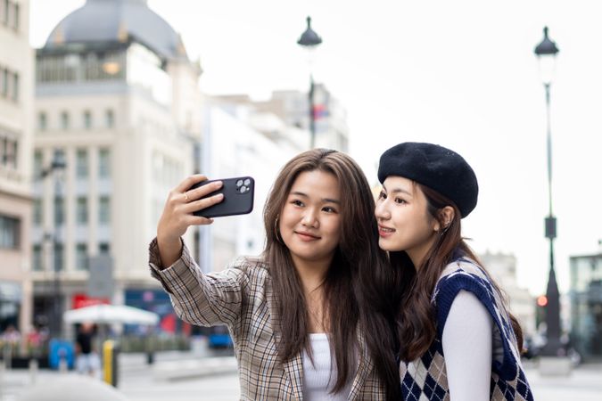 Asian Female Tourists Capturing Memories in Madrid