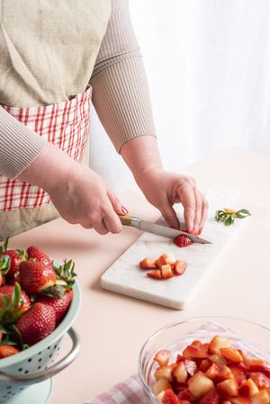 Woman preparing strawberries