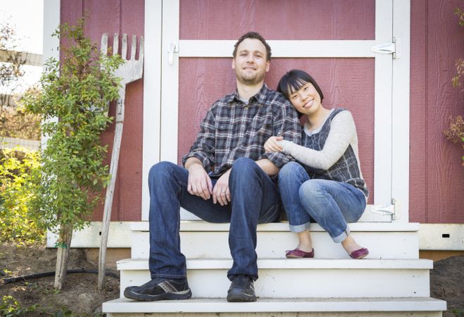 Interracial Couple Relaxing on the Steps