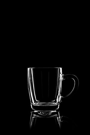 Clear glass mug with dark background
