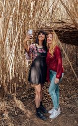 Young women looking in smartphone