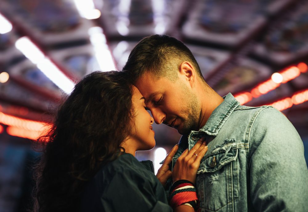 Cute couple facing each other with eyes closed