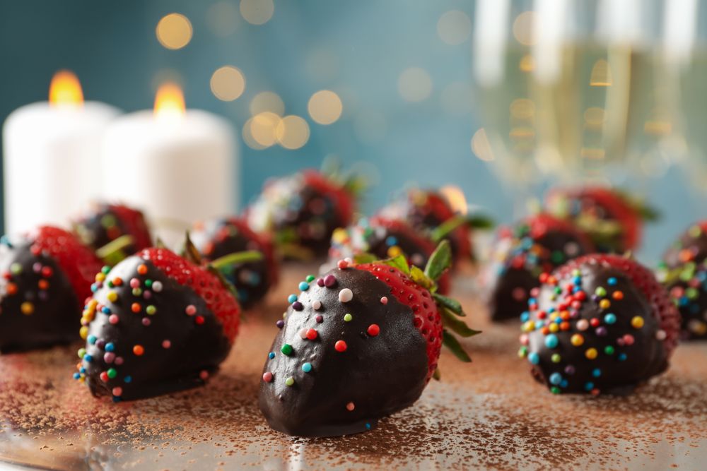 Composition with chocolate fondue, close up Delicious sweet food