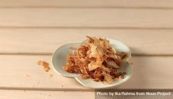 Dried bonito flakes on wooden table 5X1vK4