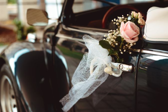 Flower on handle of retro car
