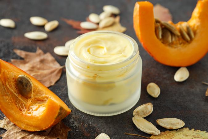 Skin care and face care concept - pumpkin cosmetic