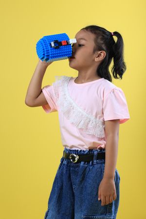 Asian Girl Kids Drink Water from Blue Cute Cup