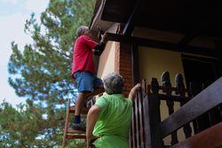 A woman and a man renovating their home.