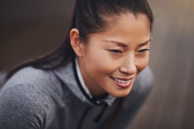 Close up portrait of happy woman in workout gear