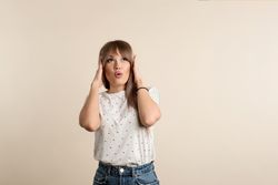 woman posing in pastel background