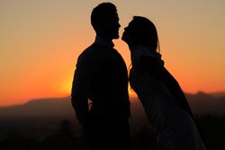 Outline of male and female couple at dusk