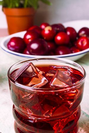 Red drink near fresh fruits