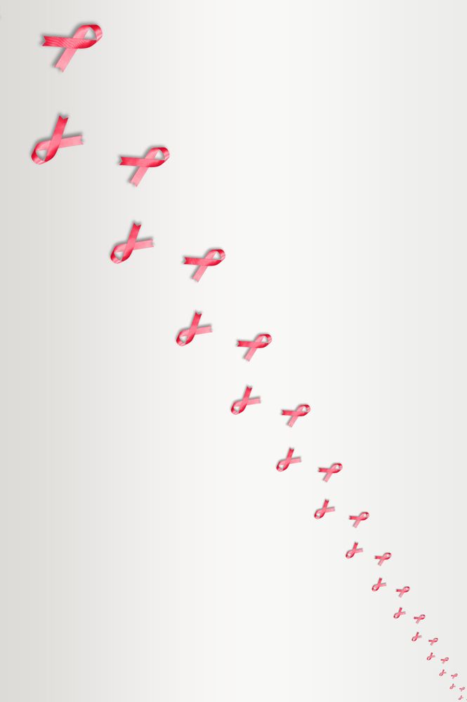 Two rows of pink ribbons on bright background
