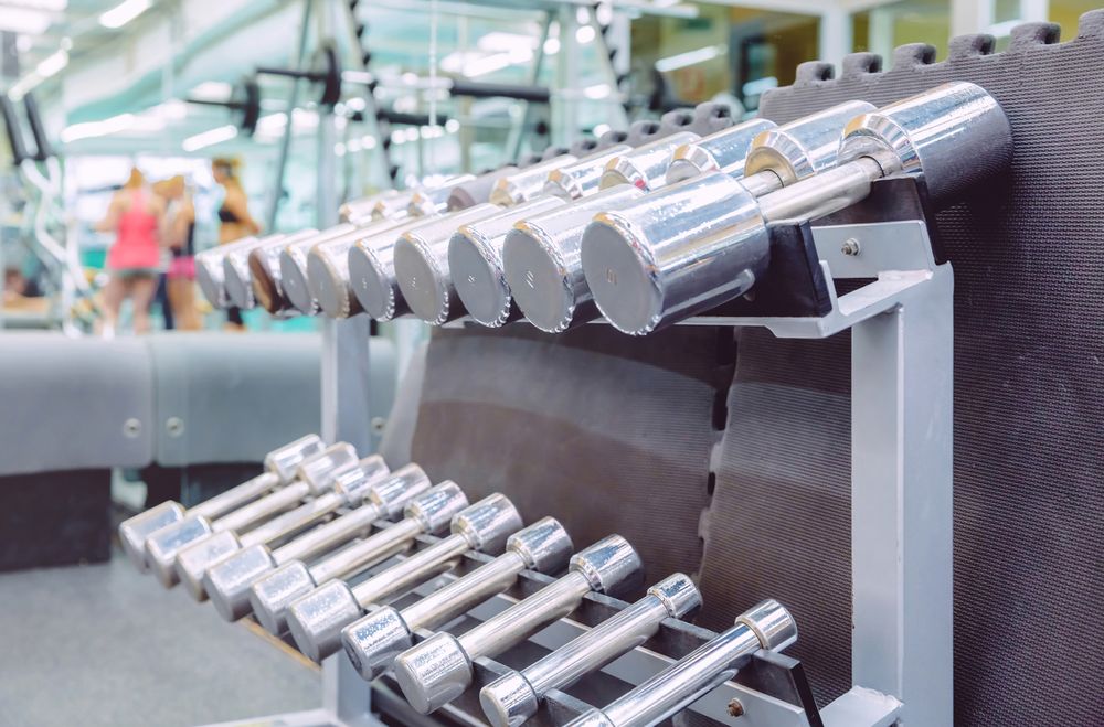 Silver weights racked in gym