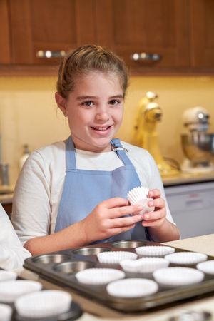 Cute girl with cupcake liner