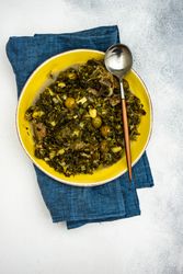 Chakapuli is a Georgian stew with napkin and spoon