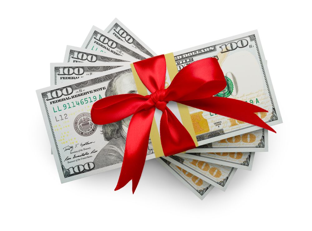Fifty Thousand Dollars Stack of One Hundred Dollar Bills Wrapped in a Red Bow