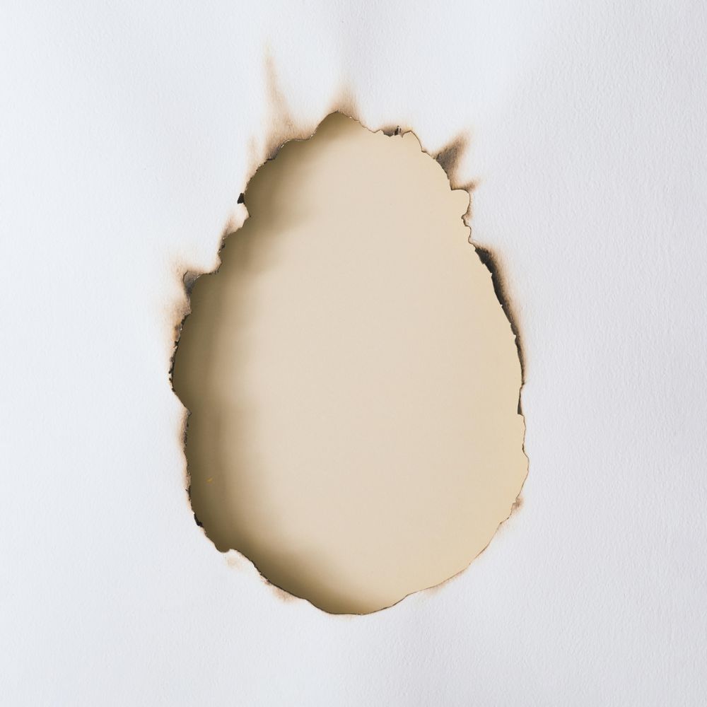 Canvas or paper burnt in egg shape
