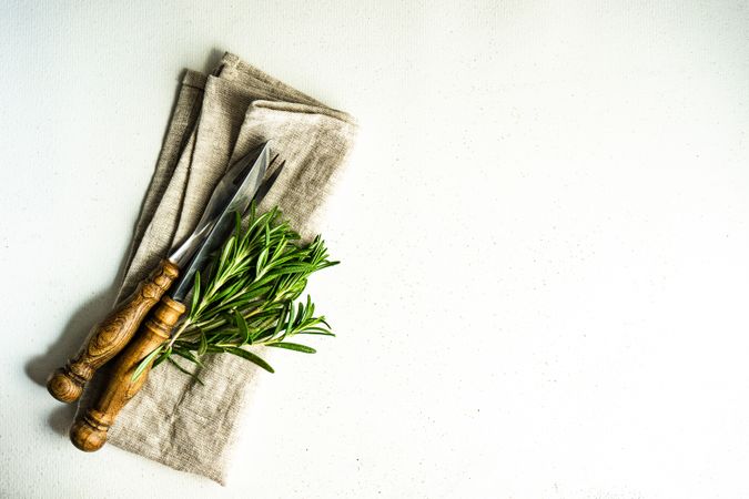 Rustic table setting with fresh rosemary sprig