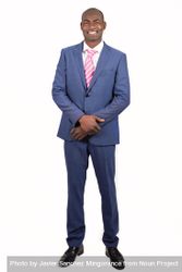 Smiling male in business attire standing tall with blank background 0PVEa4
