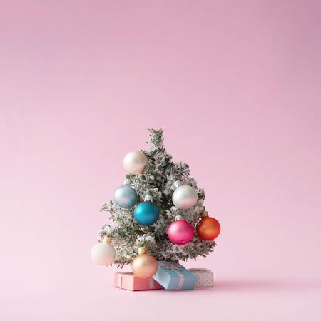 Colorful Christmas tree on pastel pink