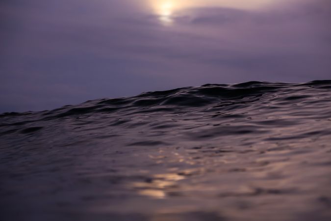 Water wave and cloudy sky