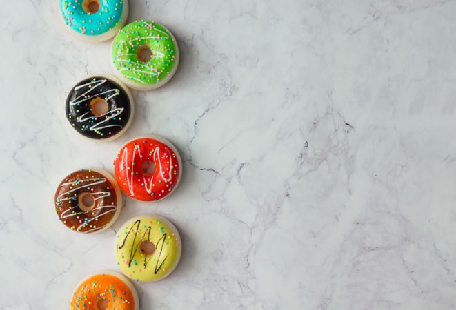 Colorful donuts on marble background