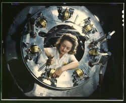 Inglewood, CA, USA - 1942: Woman working on B-52 engine 0L1AD5