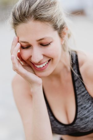 Sportswoman in active clothing smiling