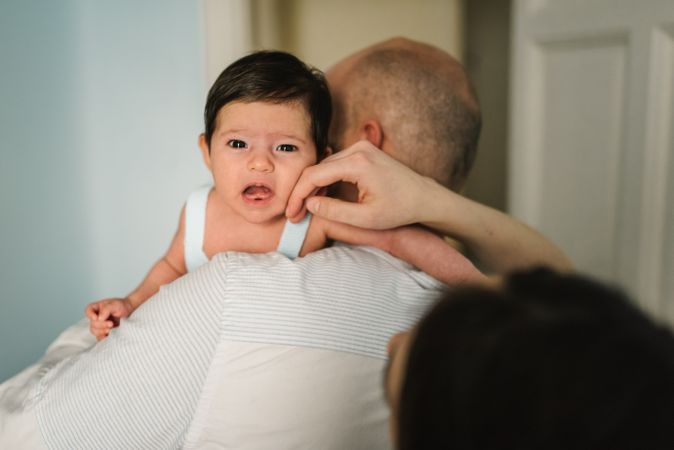 Father hugging cute baby
