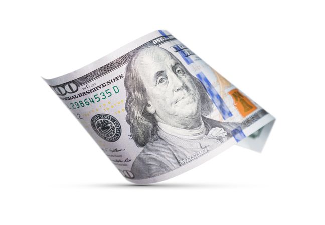 One Hundred Dollar Bill Floating Down To Surface with Drop Shadow