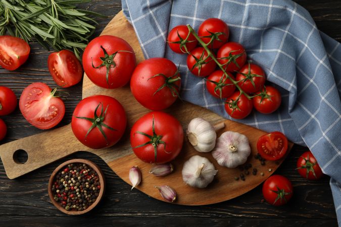 Composition with tomatoes on wooden background. Ripe vegetable