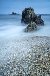 Playa de Gueirua stone beach on foggy day