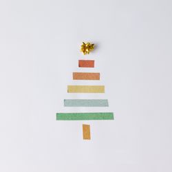 Minimalistic Christmas tree made of tape on light background