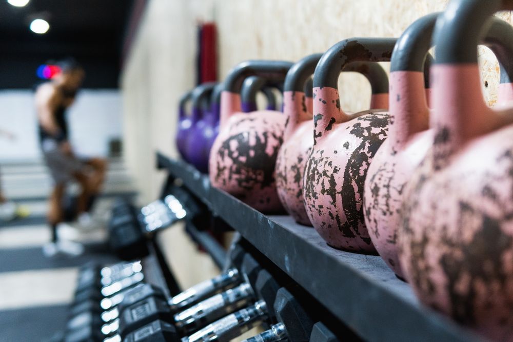 Dumbbells and kettlebells in gym