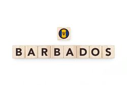 Wooden blocks bearing the name and flag of Barbados. Barbadian and Caribbean Culture, national identity, travel, and geography in a copy space design.