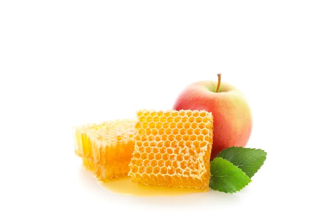 Pieces of honeycomb and apple isolated on plain background