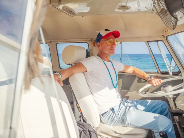 Man driving in a sea cost