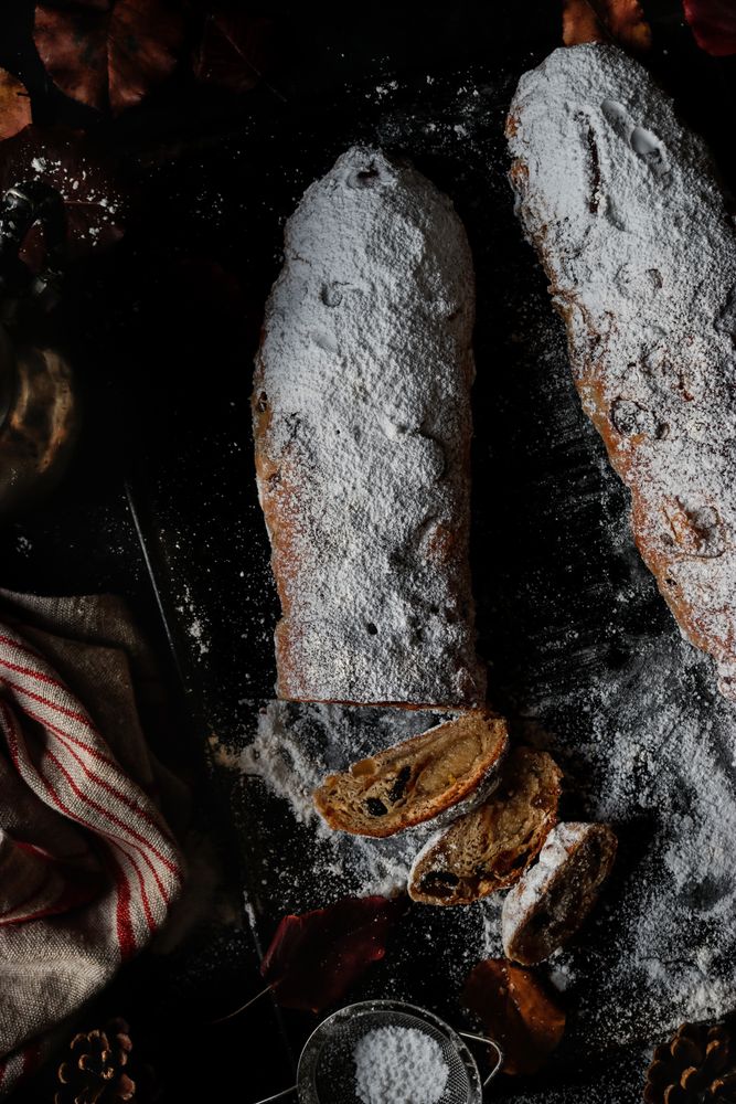 Pieces of Stollen near sieve and autumn leaves