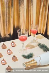 Table with festive decorations, champagne and glasses against a gold curtain 5pkZy0