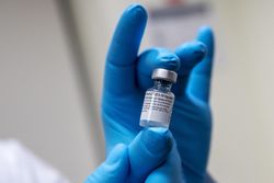 Close up of a vial of COVID vaccine