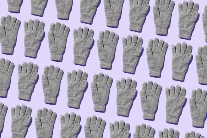Gray gloves on lavender background