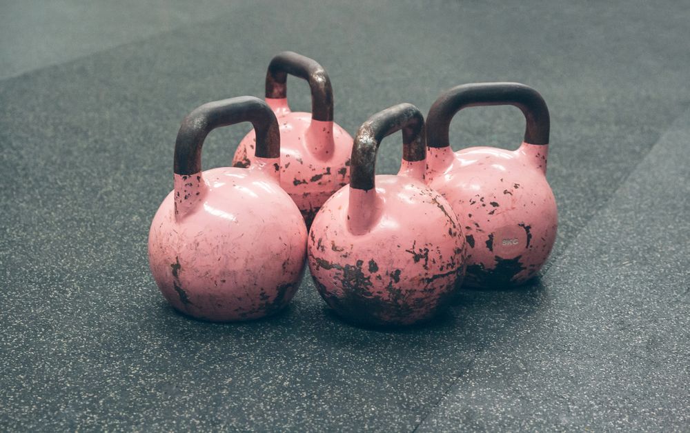 Kettlebells on the floor of a gym